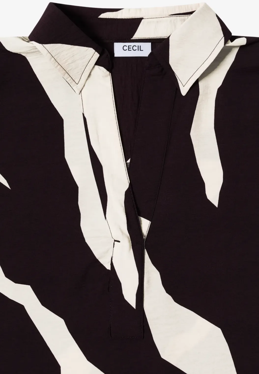 Bedrukte blouse met getapete manchetten