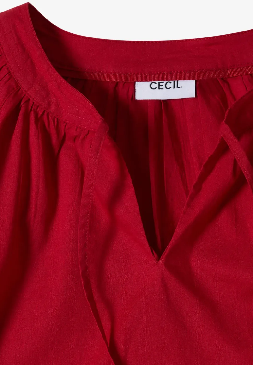 Blouse met 3/4 mouwen en gespleten hals in effen kleur