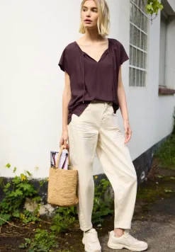 Blouse met hangende schouder en linten