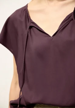 Blouse met hangende schouder en linten
