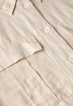 Blouse met knoop in de zoom
