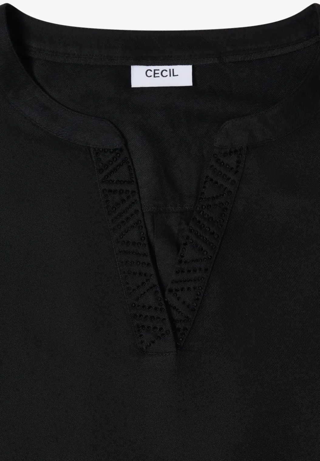 Blouse met glitterdetails