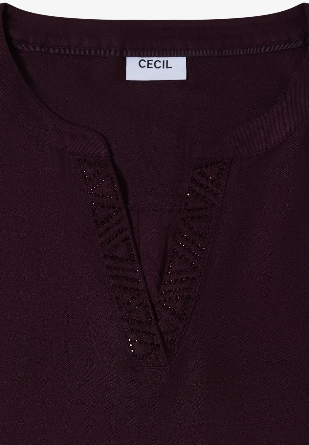 Blouse met glitterdetails