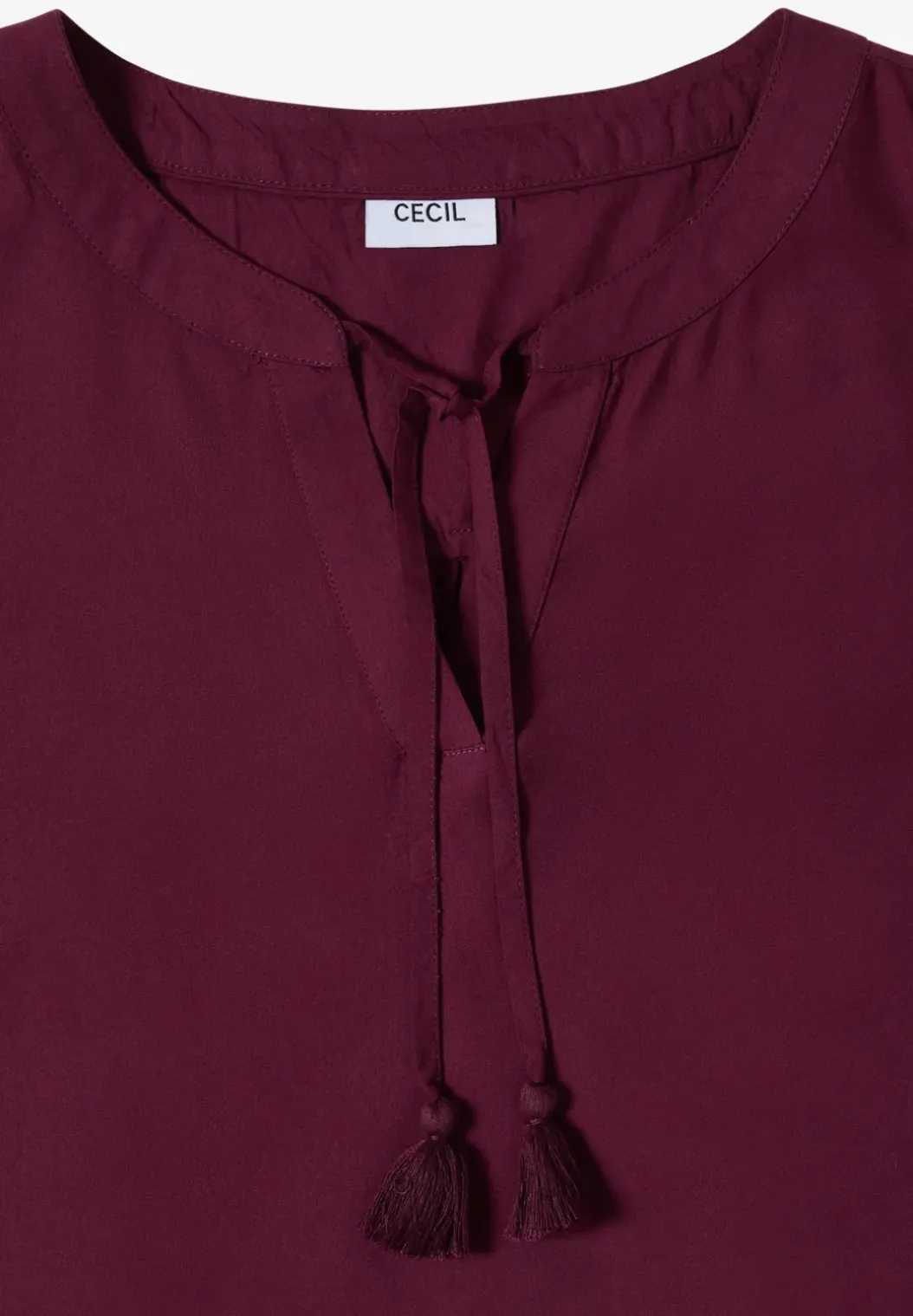 Blousetop met gespleten hals en linten