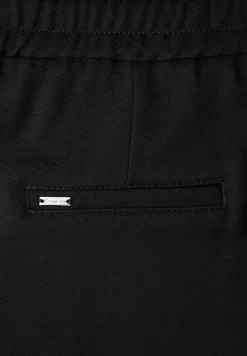 Broek met rechte pijpen en tape