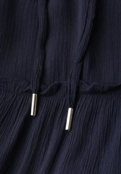 Knielange rok met volants en zakken