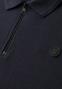 Poloshirt met rits en structuur