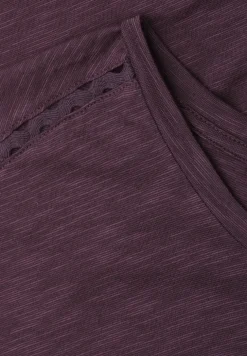 Shirt met overhangende schouder en decoratieve tape