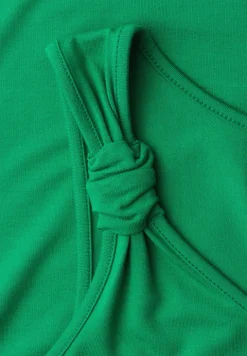 Top met V-hals en knoopdetail