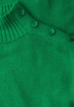 Trui met knoopdetail
