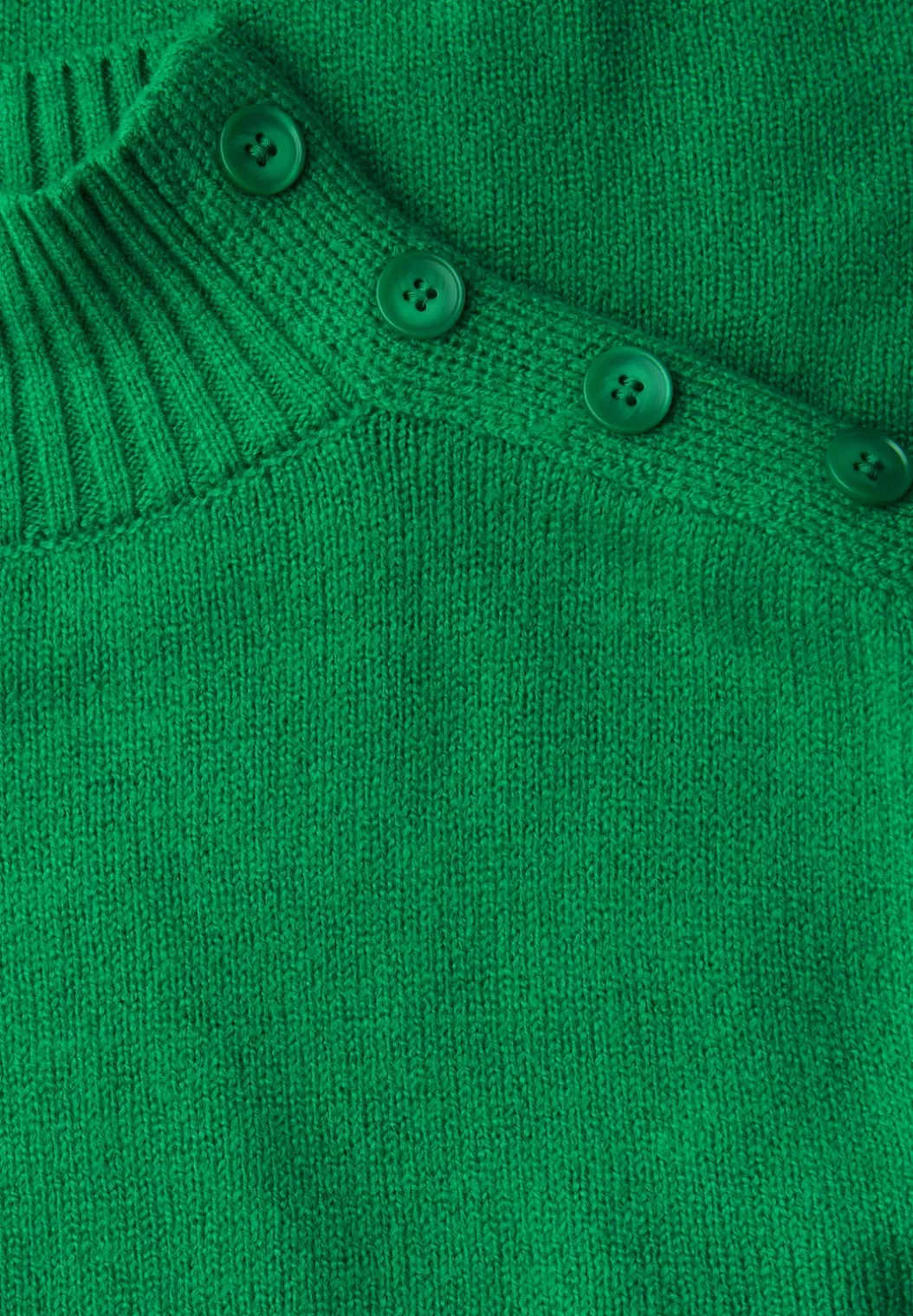 Trui met knoopdetail